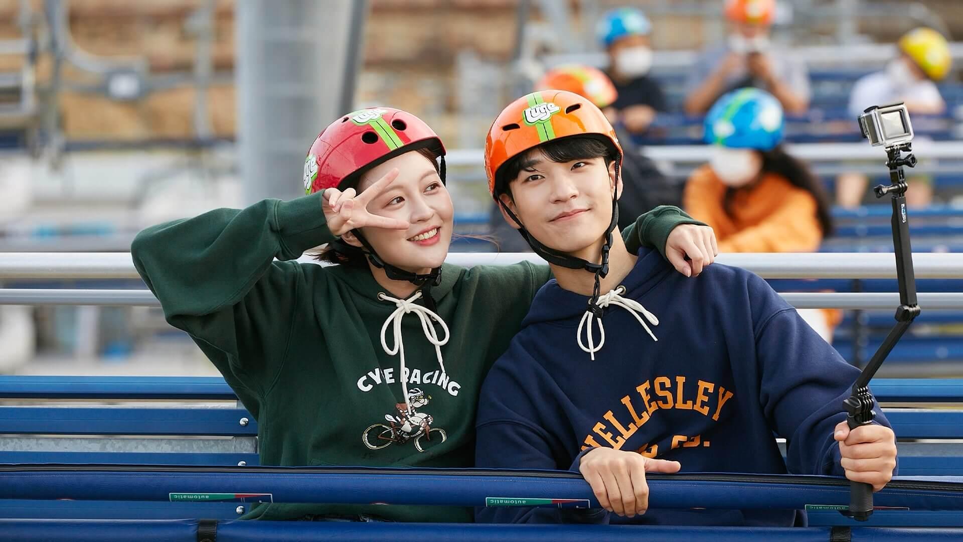 A couple poses for a photo whilst on the Busan Luge chairlift.
