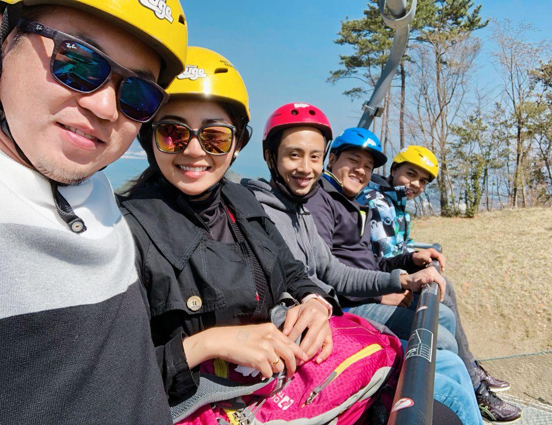 A group of people ride the Skyride together.
